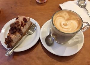 Pecan “cheesecake” and oat milk latte   at Sundowners in Exmouth