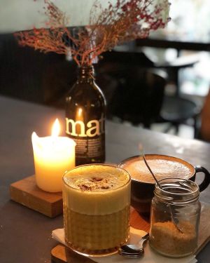 Kurkuma latte and coffee  at Kuddelmuddel Cafe  in Berlin