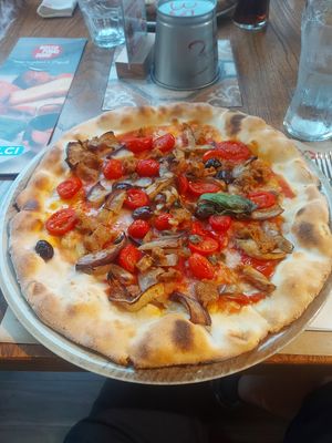 Vegan pizza with eggplant and vegan sausage at Rossopomodoro in Trieste