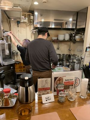 the chefs in their kitchen  at Noodle Stand in Tokyo