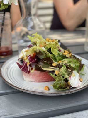 The summer salad is delightful. Avocado dressing and cashew cream savoury in the sweet watermelon base. So yum! at W6 Garden Centre Cafe in West London