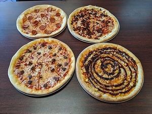 Pepperoni, Chorizo, Impossible, and BBQ chicken pizza  at Veganos Kitchen in Las Vegas