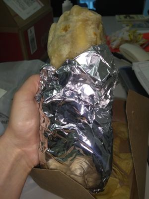 Huge, tasty burrito with homemade chips on the side!  at Veganos Kitchen in Las Vegas
