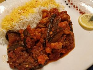 Celo Khoresh Bademjan (eggplant, Tomato, sour grapes, served with steam rice.  at Cardamom Persian Palace in Como