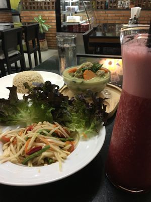 Bravo smoothie, papaya salad, green curry, and brown rice. Yummy! at Alchemy Vegan in Chiang Mai