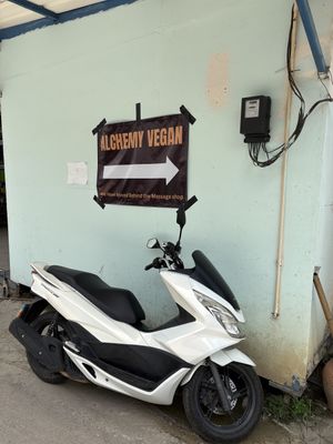 look for signs to direct you from the massage parlor   at Alchemy Vegan in Chiang Mai