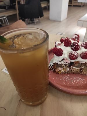 Coffee Lemonade with a cake made of pineapple, apple, nuts and strawberry. at Pulpa Amor Liquido  in Mexico City