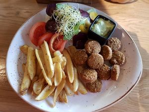 falafel, fried potato, vegetables, sauce at Pepper Grey in Klaipeda