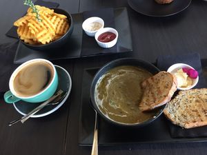Americano, waffle fries and vege soup with toast  at Raw Sugar Cafe in Christchurch