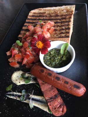 Toast with bruschetta, pesto, and sausage (all vegan).  at Raw Sugar Cafe in Christchurch
