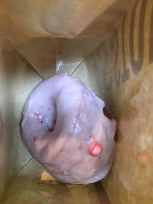 Strawberry elderflower doughnut in the bag at Crosstown Doughnuts - Victoria in London