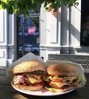tofu burger&seitan burger on outdoors tables at Koluchka in Rostov-on-don
