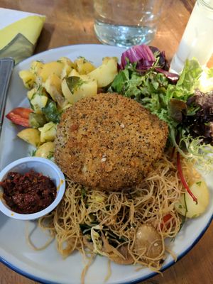 Thai burger with harissa sauce and side salads at Henderson's Shop and Salad Table in Edinburgh