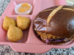 Signature fried chicken sandwich and half of the jalapeno poppers at Veggy Street in Las Vegas