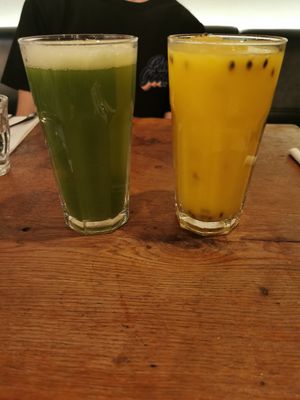 Cucumber and ginger juice (green) and Orange and passion fruit juice (yellow) at Vantra Vegan in London