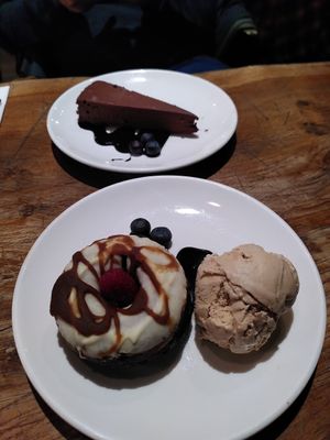 Apple toffee doughnut with caramel nice cream and a raw ganache cake at Vantra Vegan in London