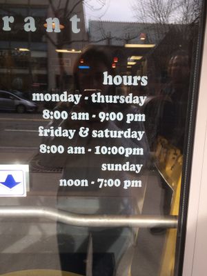 Hours on door  at Stromboli's Restaurant in Rochester