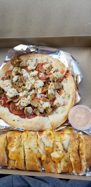 Pizza and Buffalo chicken calzone at Stromboli's Restaurant in Rochester