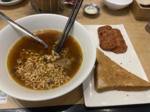 Half eaten delicious Cha Chaan Teng option of unlimeat noodles   at Green Common - Park Central in New Territories