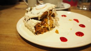 Vegan Carrot Cake [£4.50] served with a side of plant milk  at Henderson's Restaurant in Edinburgh
