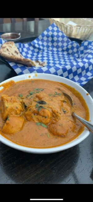 Soya chunks in curry sauce and a vegan paratha flat bread (only half of it showing in photo)   at Indian Kitchen in Golden