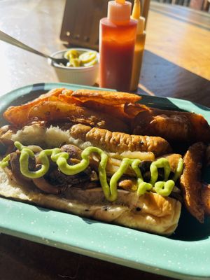 Hotdog with mushrooms and potato wedges   at The Green Place in Puerto Vallarta
