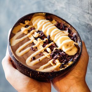 Chunky Monkey smoothie bowl. Banana, cocoa powder, peanut butter. at The Green Place in Puerto Vallarta