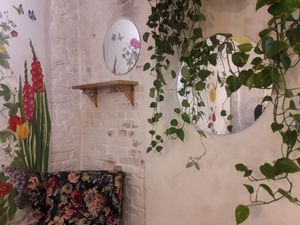 Interior with floral mural at Geranium Caffe in Poznan