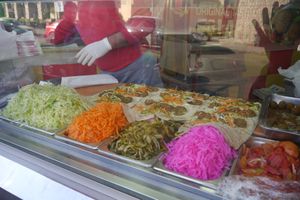 The ingredients and the making of 9 rolls at a time. at Sandwich Falafel W Bas in Aqaba