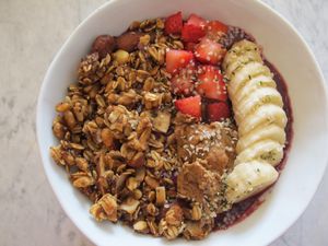 Pro Superberry bowl. A smoothie with cashew milk, pitaya, blueberries, strawberries, kale, avocado, spinach, dates, and vanilla extract topped with granola, banana, seasonal berries, almond butter, and hemp seeds. at Fruitive - Colley Ave in Norfolk