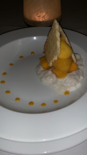Rice pudding with mango sorbet, fresh mango and coconut crumble, last course of the set menu at The Pepper Tree in Phu Quoc