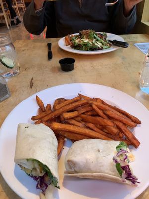 Quinoa salad wrap with sweet potato fries   at Solid Grill & Bar in Boise