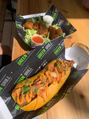 Kimchi dawg with spicy sriracha sauce. Sausage is made of seitan and in a turmeric bun. Banging flavours, maybe kimchi cut a bit smaller to be easier to eat. at The Green Grill - Walthamstow in East London