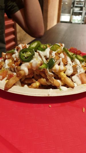 Asada nacho fries at Doomie's NextMex - Vine in Hollywood