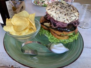 Burguer de garbanzos con berenjena, calabacín, tomate y lechuga. at Happy Cactus in Fuerteventura