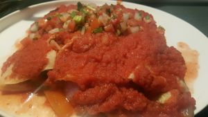 vegan veggie enchiladas with red sauce at Cacao Restaurant in Kansas City