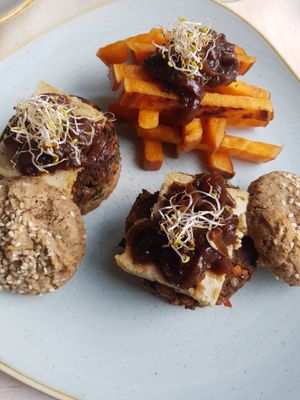 Veggie burger with homemade almond cheese and sweet potato  at Glow in Belgrade