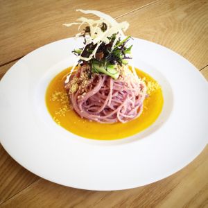 Carrot pasta.
Spaghetti tossed with purple carrot pesto served with carrot sauce and fresh greens. at Hikari Shokudo in Nasushiobara