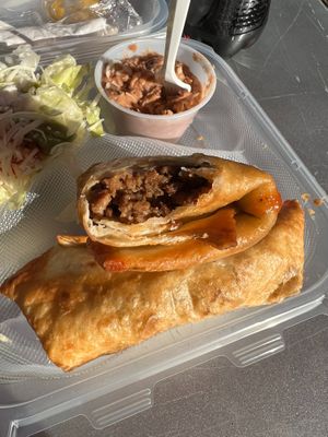 Vegan beef chimichanga with Mexican salad and refried beans at Nacho Taco in Jacksonville