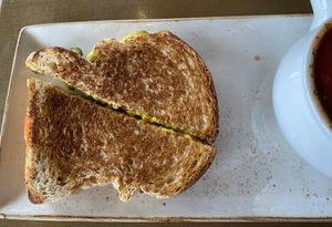 Grilled Cheese with pickles and tomato inside   at The Moth Cafe - Downtown in Edmonton