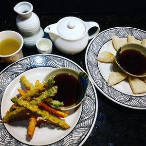 Vegan asparagus and sweet potato tempora with agedashi tofu, green tea and sake. at Zen of Sushi in Port St Lucie