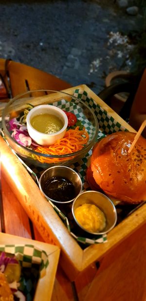 Olive bun, salad on the side at La Bruja Vegan Foods in Antigua