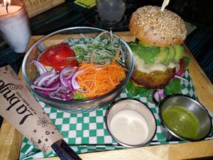 Eggplant burger, seed bread at La Bruja Vegan Foods in Antigua