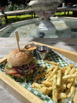 quinoa and bean burger with fries. sauces: bbq and chilli mayo  at La Bruja Vegan Foods in Antigua