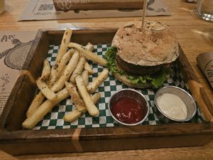 Beyond burger with fries at La Bruja Vegan Foods in Antigua