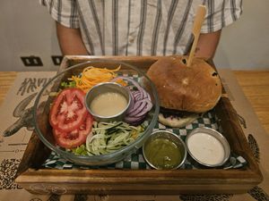 Seitan burger with salad at La Bruja Vegan Foods in Antigua