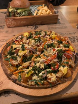 Build your own pizza with tofu cheese at La Bruja Vegan Foods in Antigua