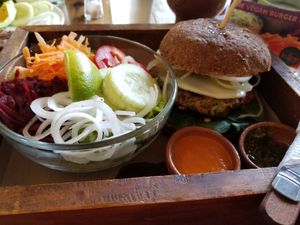 Vegan burger (tofu base) with side salad at La Bruja Vegan Foods in Antigua
