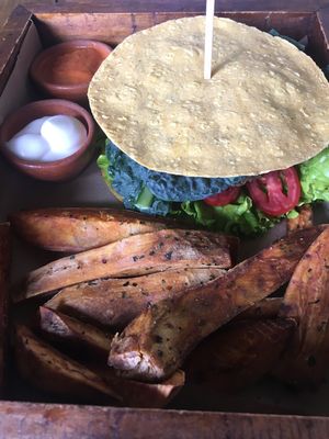 Lentil burger with gf tortillas and sweet potato fries.  at La Bruja Vegan Foods in Antigua