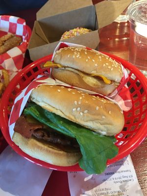 Deluxe bacon cheeseburger and a bacon egg and cheese.  at Santana's Vegan Grill in Colorado Springs